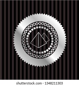 pyramids icon inside silvery emblem or badge