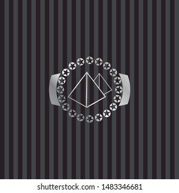 pyramids icon inside silvery emblem