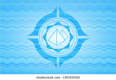 pyramids icon inside water concept badge background.