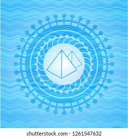 pyramids icon inside water emblem background.