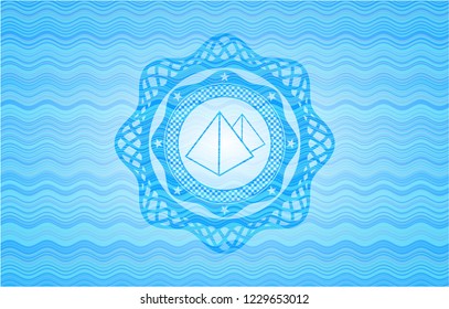 pyramids icon inside water wave concept emblem background.