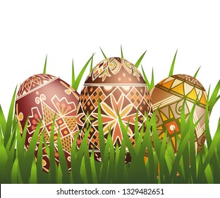 Pysanky easter eggs in grass isolated on white. Traditional ukrainian easter eggs.