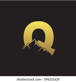 Q alphabet mountain negative space letter logo gold black background