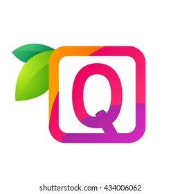Q letter in square with juice and green leaves. 