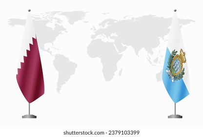  Qatar and San Marino flags for official meeting against background of world map.