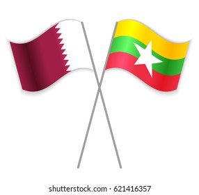 Qatari and Burmese crossed flags. Qatar combined with Burma isolated on white. Language learning, international business or travel concept.