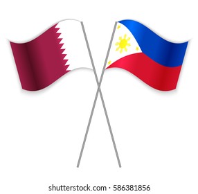 Qatari and Filipino crossed flags. Qatar combined with Philippines isolated on white. Language learning, international business or travel concept.