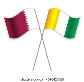 Qatari and Ivorian crossed flags. Qatar combined with Ivory Coast isolated on white. Language learning, international business or travel concept.