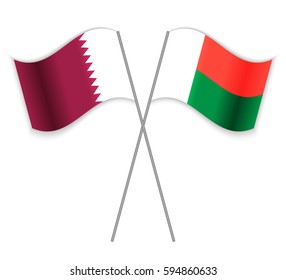 Qatari and Malagasy crossed flags. Qatar combined with Madagascar isolated on white. Language learning, international business or travel concept.