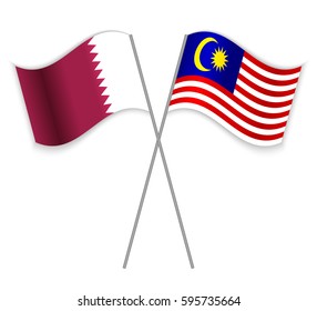 Qatari and Malaysian crossed flags. Qatar combined with Malaysia isolated on white. Language learning, international business or travel concept.