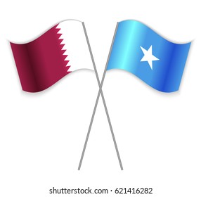 Qatari and Somali crossed flags. Qatar combined with Somalia isolated on white. Language learning, international business or travel concept.