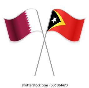 Qatari and Timorese crossed flags. Qatar combined with East Timor isolated on white. Language learning, international business or travel concept.