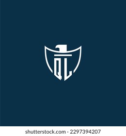QL initial monogram logo for shield with eagle image vector design