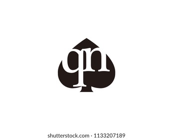 The qn initials logo inside the black shovel