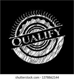 Qualify written on a blackboard