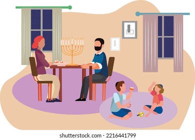 Quality family time during the holidays, an ultra-Orthodox Jewish father and mother sitting in front of a table with Hanukkah and donuts And  children plays in a spinning wheel on a carpet in Hanukkah