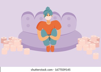 The quarantined girl. Sits at home on a sofa in a medical mask. Around her a lot of toilet paper. Covid - 19.