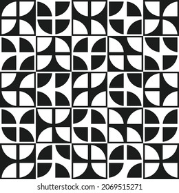 The quarters of the circle are on checkerboard tiles. White and black shapes on vector seamless pattern.