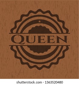 Queen badge with wood background