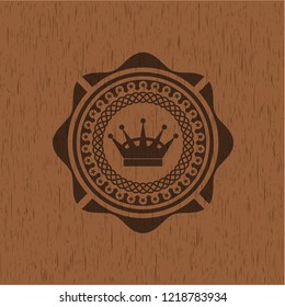 queen crown icon inside badge with wood background