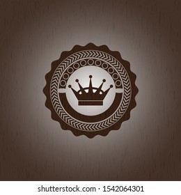 queen crown icon inside badge with wooden background