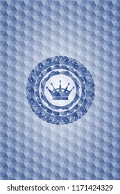 queen crown icon inside blue emblem with geometric pattern.