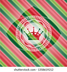 queen crown icon inside christmas emblem background.