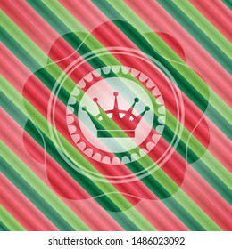 queen crown icon inside christmas badge background.