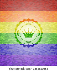queen crown icon inside emblem on mosaic background with the colors of the LGBT flag