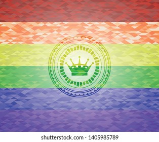 queen crown icon inside emblem on mosaic background with the colors of the LGBT flag