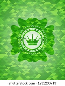 queen crown icon inside green mosaic emblem