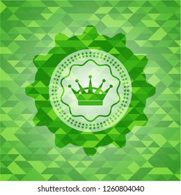 queen crown icon inside green emblem with triangle mosaic background