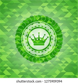 queen crown icon inside green emblem. Mosaic background