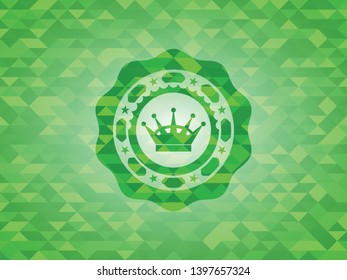 queen crown icon inside green mosaic emblem