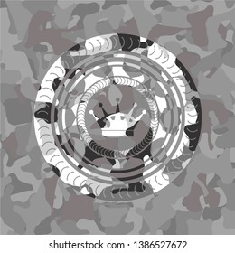 queen crown icon inside grey camouflaged emblem