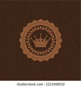 queen crown icon inside realistic wooden emblem