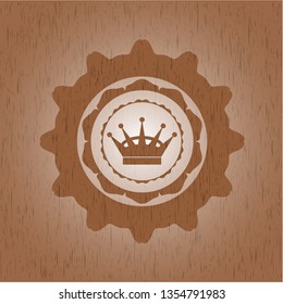 queen crown icon inside realistic wood emblem