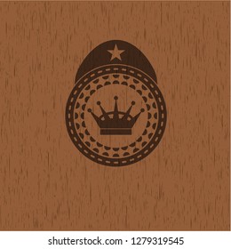 queen crown icon inside retro wooden emblem