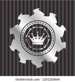 queen crown icon inside silvery emblem