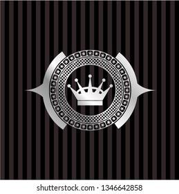 queen crown icon inside silvery emblem or badge