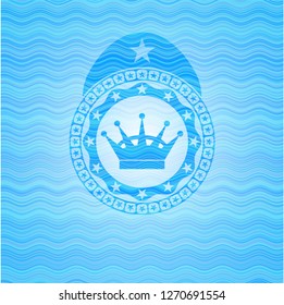 queen crown icon inside sky blue water style badge.