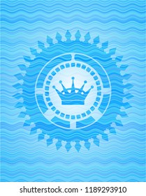 queen crown icon inside water representation emblem background.