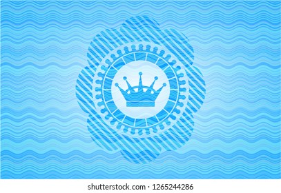 queen crown icon inside water wave representation badge background.
