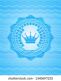 queen crown icon inside water wave badge background.