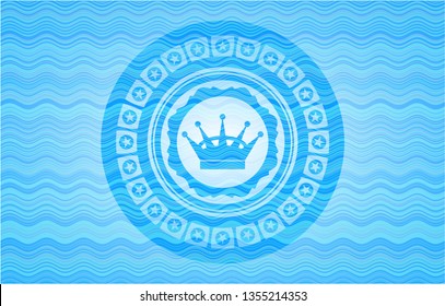 queen crown icon inside water representation style emblem.