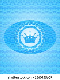 queen crown icon inside water badge.