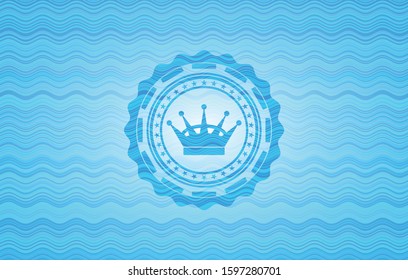 queen crown icon inside water concept emblem.