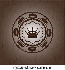 queen crown icon inside wood badge or emblem