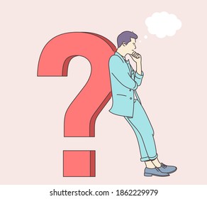 Question, brainstorm, thinking concept. The young man puzzled, confused, perplexing person, thinking about problem solution and leaned on the question mark.