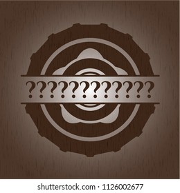 Question Mark badge with wood background